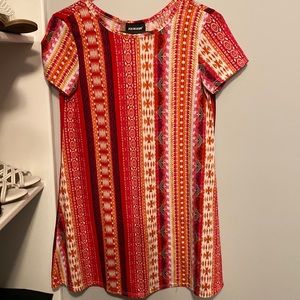 Casual summer dress. Great for the beach or over leggings.
